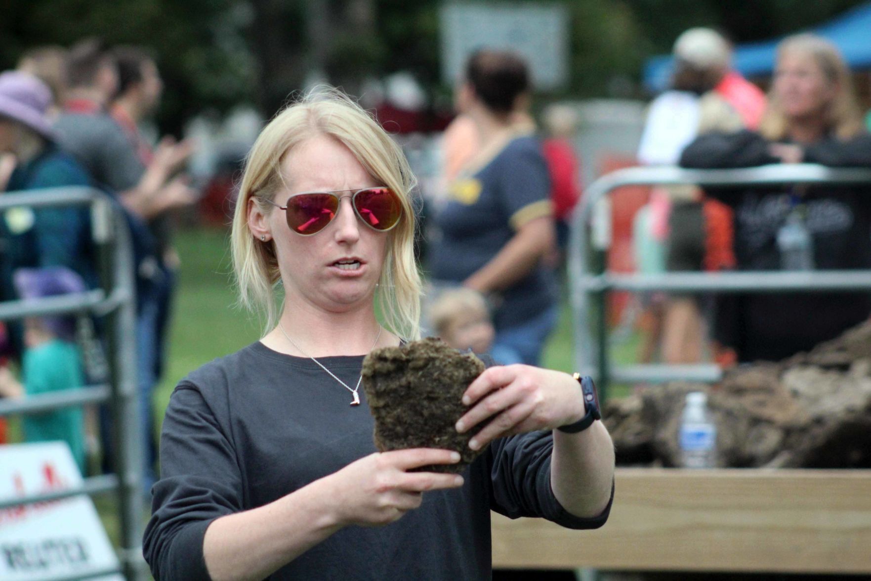 Julie examines cow chip